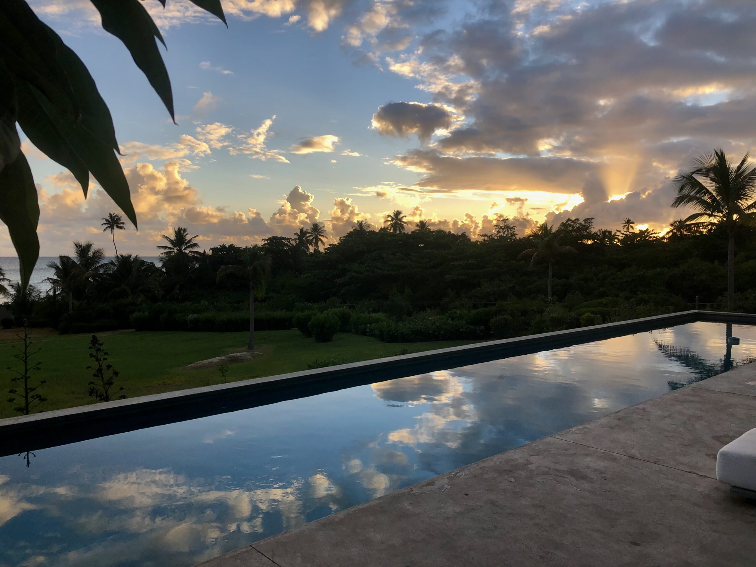 sunset view from the pool at a luxury villa