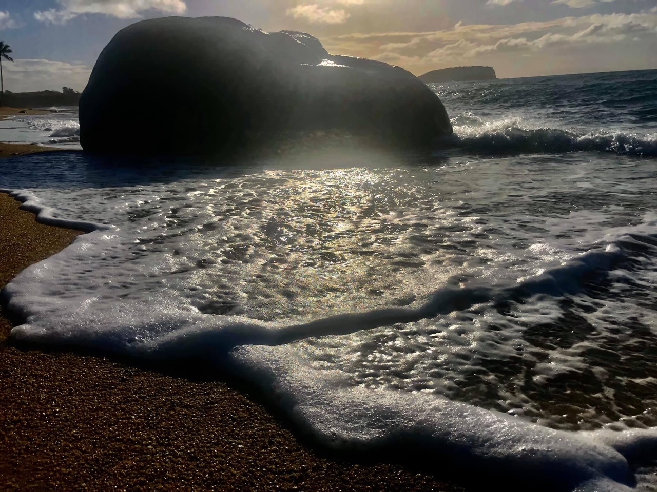 boulder in the crashing waves